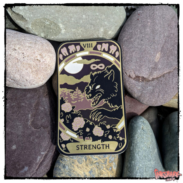 Sticker of the Strength tarot card, featuring a werewolf plucking at rose bushes, tucked on some red rocks that match the reddish-purple of the art
