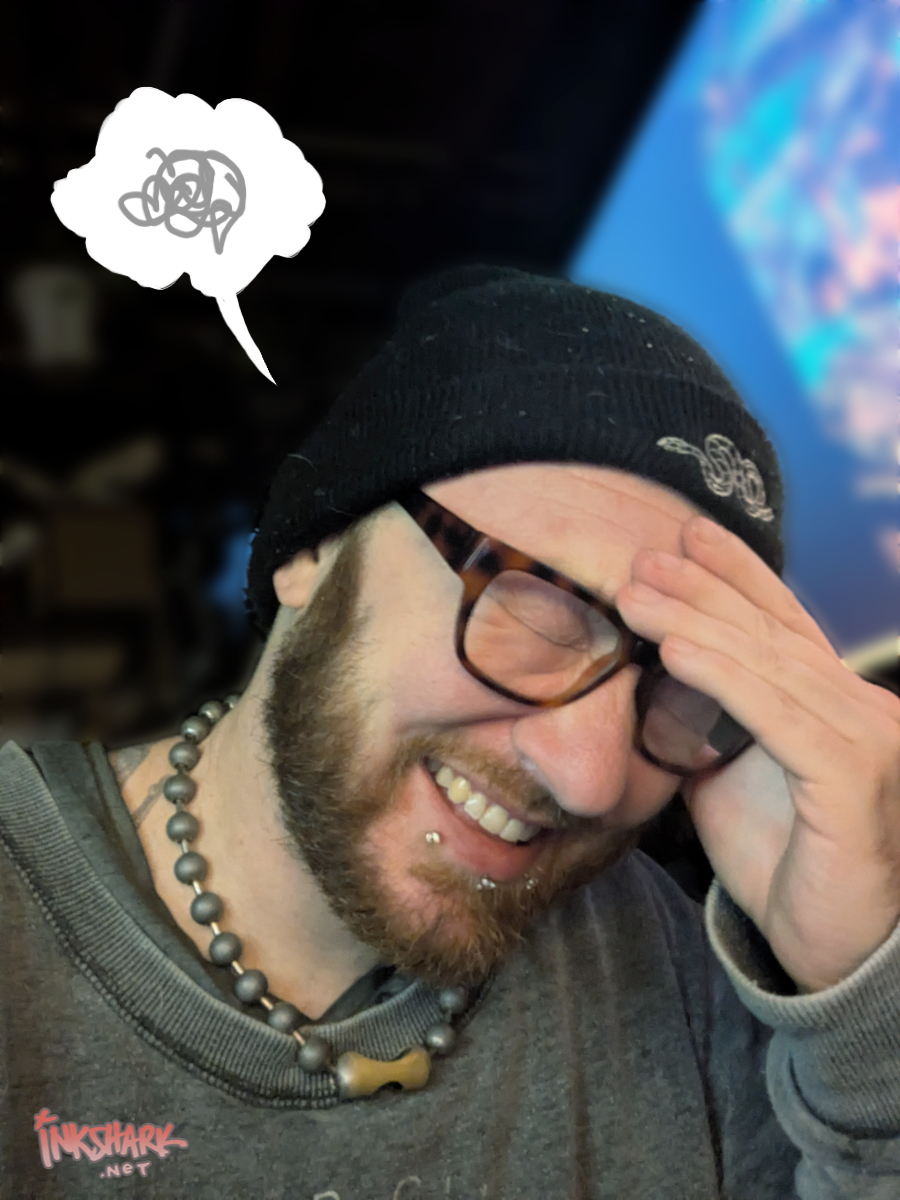 a guy in glasses and a soft beanie holding his stupid face while he laughs about sharing his lemonade disaster with the internet, it's me, i'm the stupid face guy