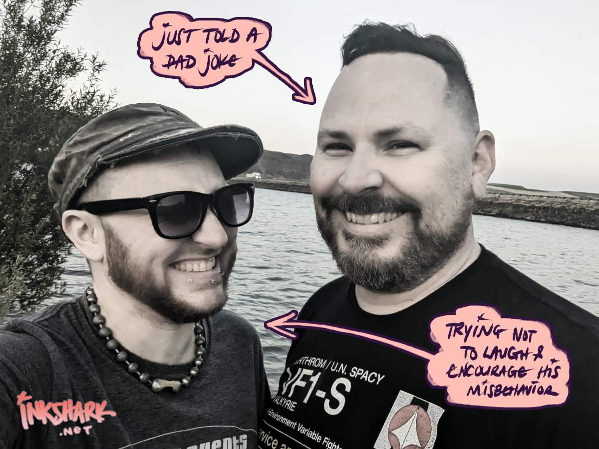 Photo of me and my partner in front of the Columbia River. Handwritten text with an arrow points at him which says "Just told a dad joke" and at me that says "trying not to laugh and encourage his misbehavior"