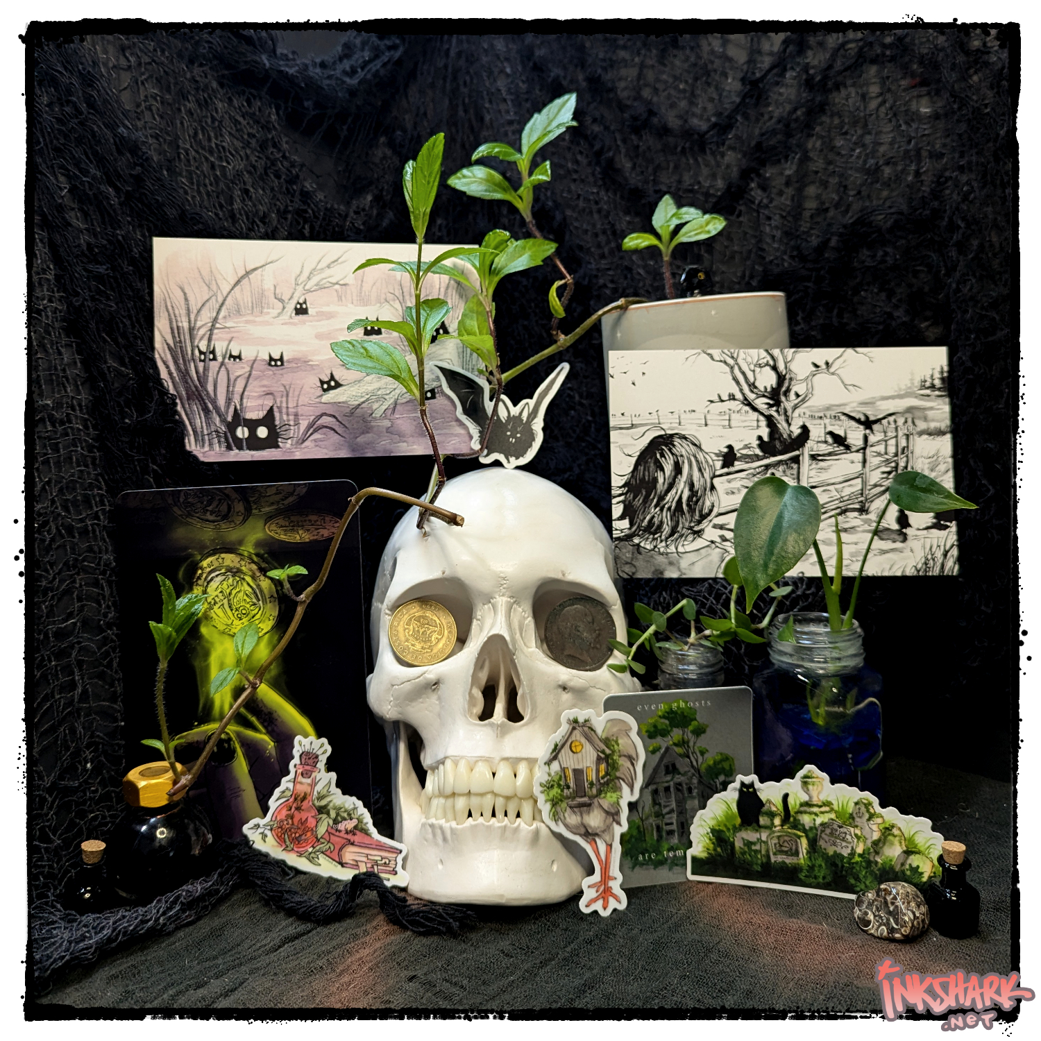 three postcards and five stickers posted with an anatomically correct skull with coins in its eye sockets, for ambience!