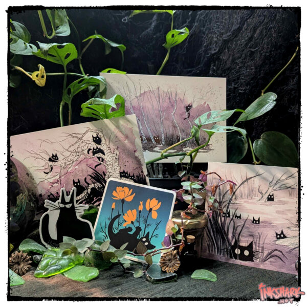 all the postcards and stickers that feature black cats arranged on a mound of worn seaglass and crowned in vines