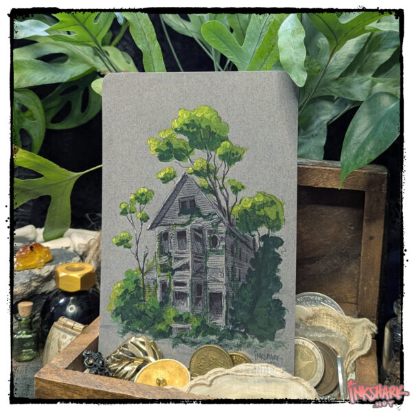 Postcard of a haunted house painting with foliage bursting up through the roof; product is posed in a wooden treasure chest of old coins, with live plants all around