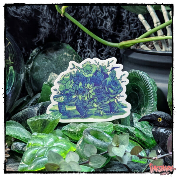 Sticker of a tortoise with a garden on her back, perched in a mass of adventurous green sea glass, with live plants guarding it